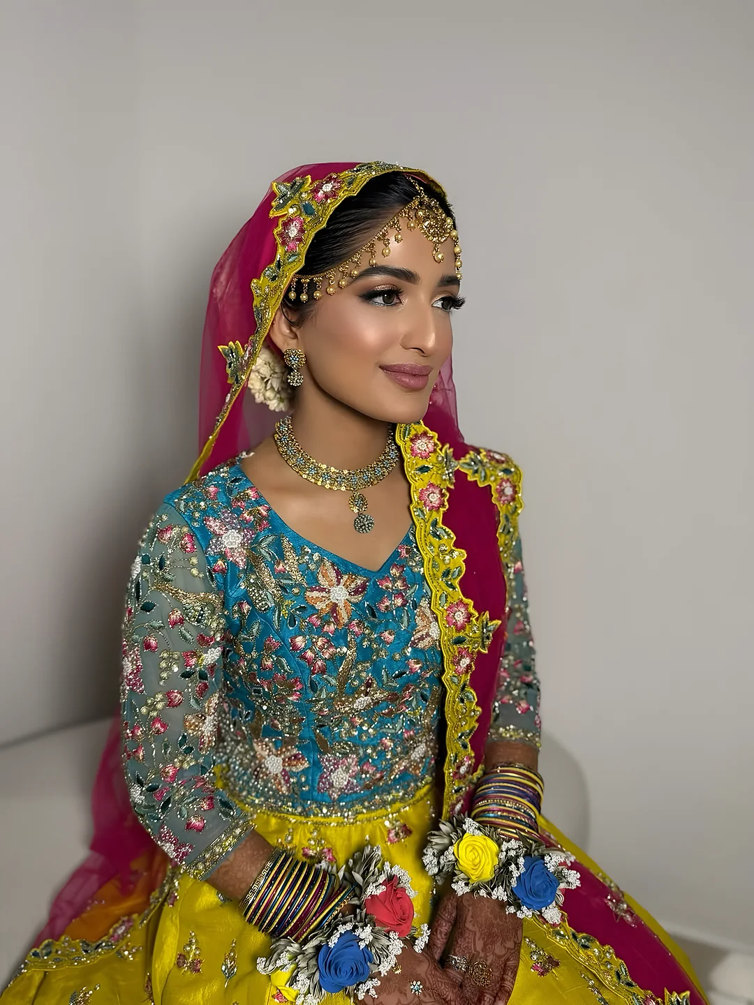 Mehndi look with a colourful dupatta
